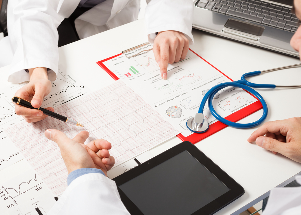 Doctors at work Doctors examining medical tests